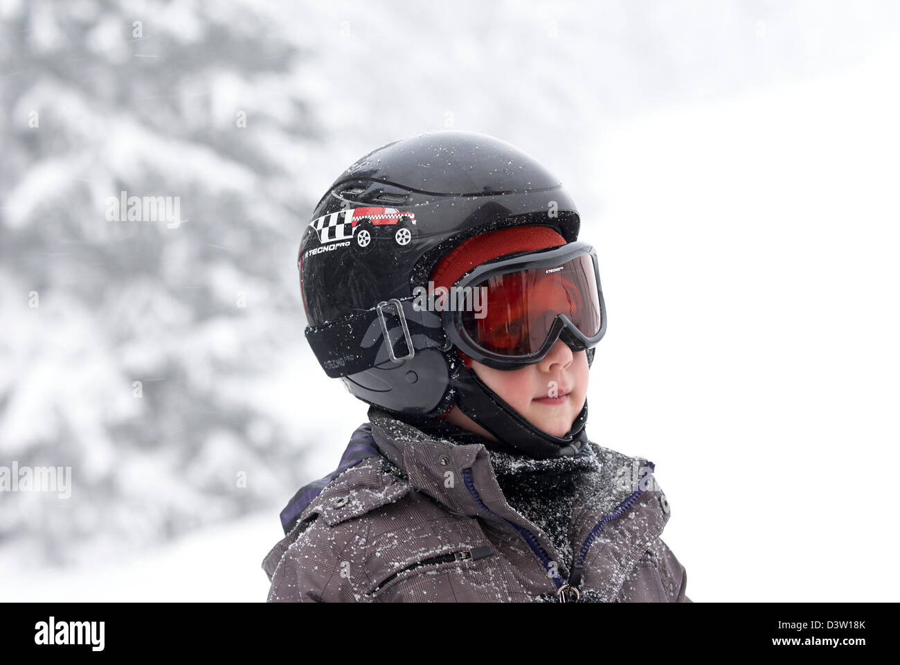 Young Child Boy in Ski Gear, portrait, winter season, snowing Stock Photo