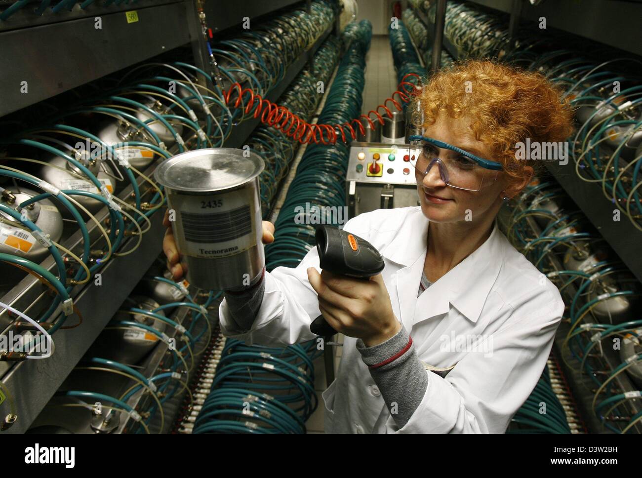 A staff member of aromatics and flavourings producer Symrise scans raw material in the Symrise plant of Holzminden, Germany, Thursday, 07 December 2006. Symrise plans to go public on Monday, 11 December and has good chances to become this year's biggest new listing with a business volume of up to 1.4 billion euro. Photo: Jochen Luebke Stock Photo