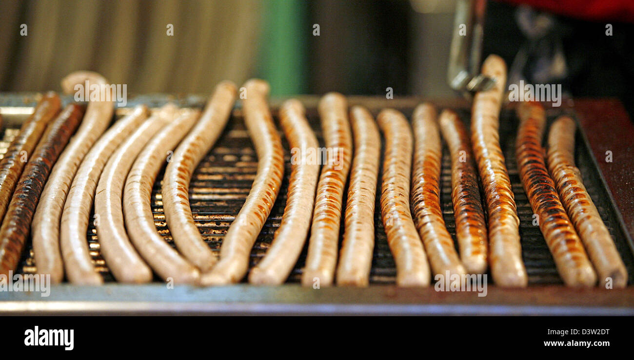 Two kinds of fried sausages are ready for sale at a snack stand on the