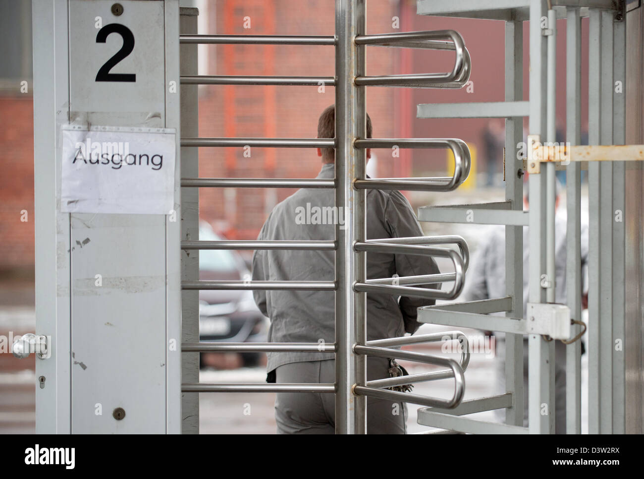 Worker from Opel stands on the company site during a works meeting behind closed doors in Bochum, Germany, 25 February 2013. PHOTO: BERND THISSEN Stock Photo