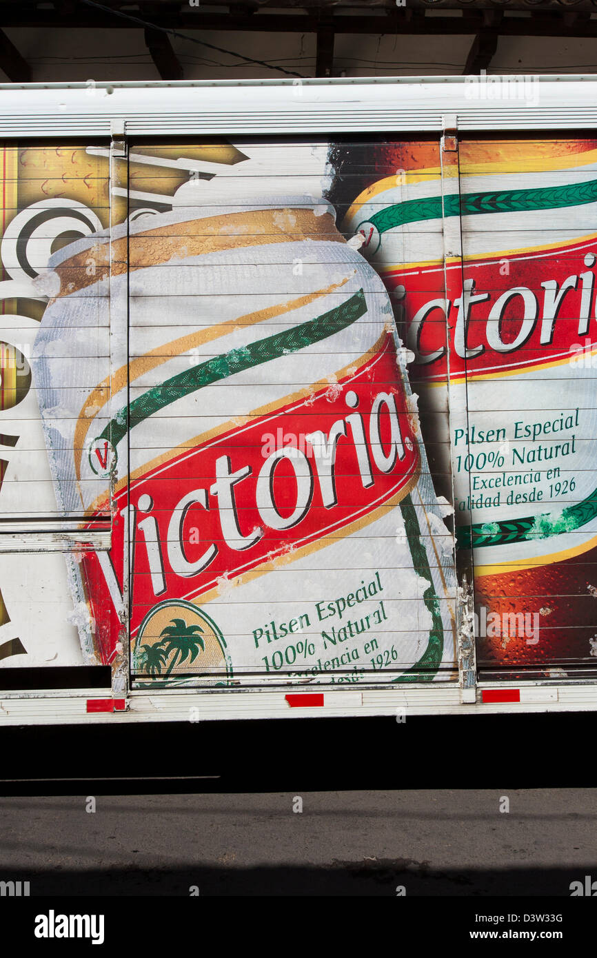 A beer delivery truck in Granada with bright decals and logos for