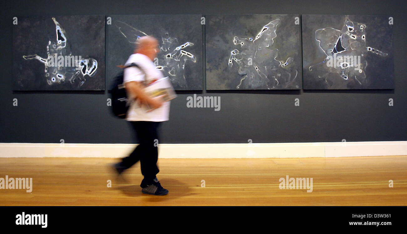 A visitor to the exhibition 'Peintures/Paintings' passes the paintings 'Les Quatre Cheveaux' by Bruno Perramant at the Martin Gropius Bau of Berlin, Germany, 22 September 2006. The exhibition within the scope of the ART FRANCE BERLIN festival runs from 23 September to 12 November. Photo: Steffen Kugler Stock Photo