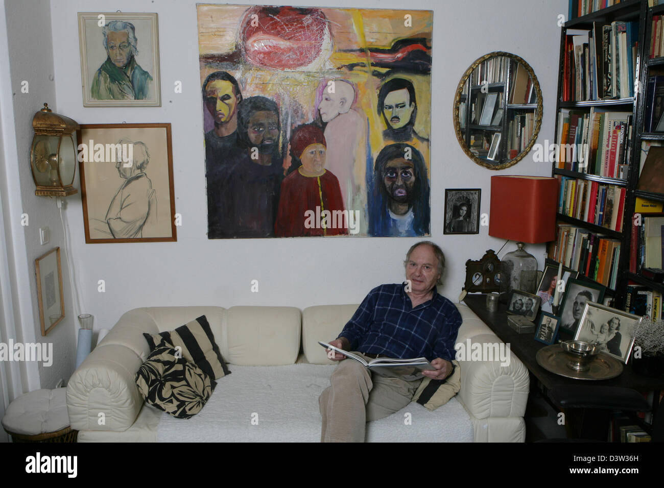 Paul von Schell (66), widower of German actress and singer Hildegard Knef sits on a sofa with a book in his hands in his flat in Berlin, 15 November 2006. The flat is still full of remembrances of his wife who had died five years ago. Paul von Schell lived together with wife, who would have turned 81 on 28 December 2006, for 25 years. He acquired the rights for the picturisation of Stock Photo