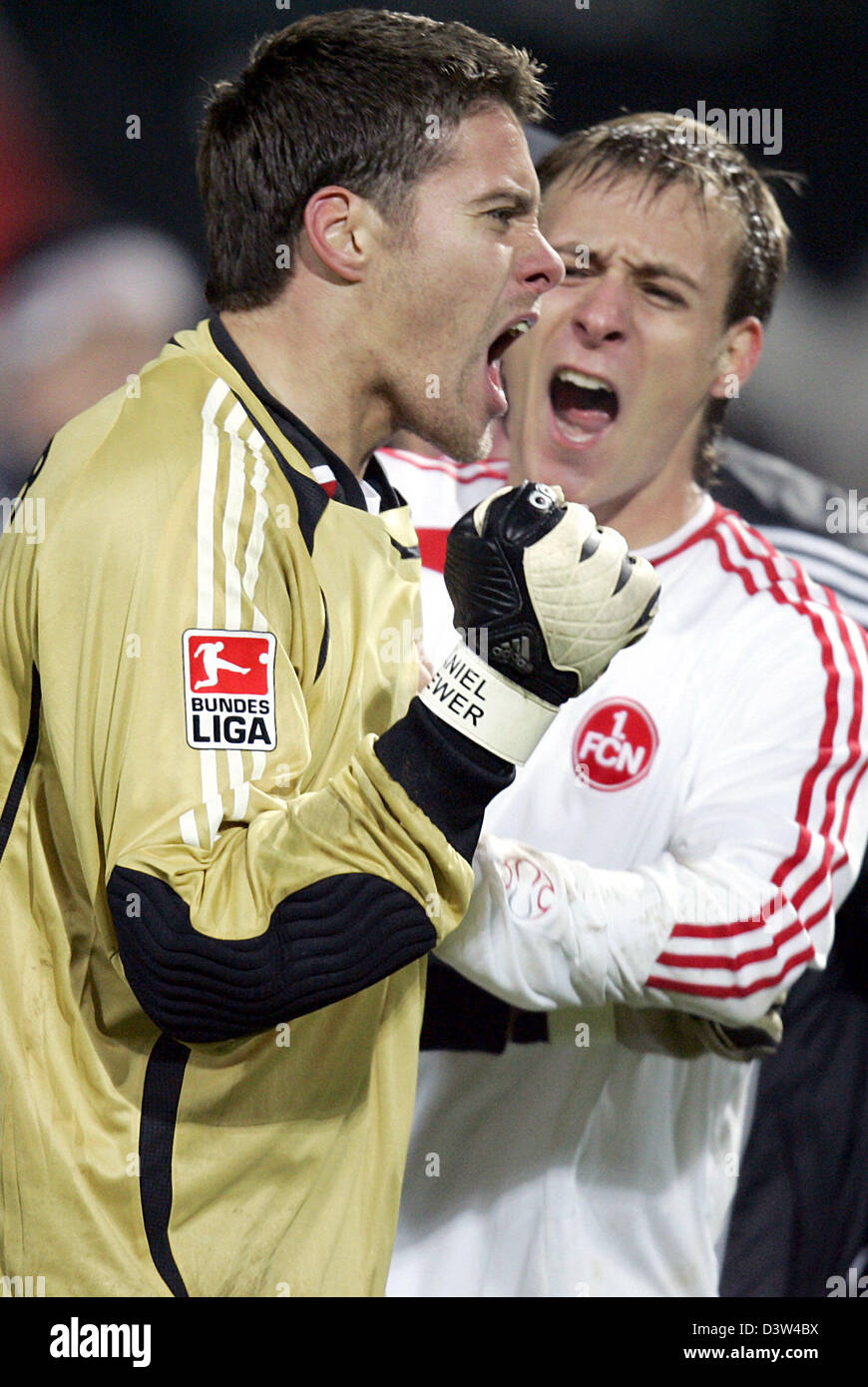 1.FC Nuremberg's goalkeeper Daniel Klewer (L) celebrates together with his teammate Dominik Reinhardt after the round of last 16 German Cup match victory over SpVgg Unterhaching at the easyCredit stadium in Nuremberg, Germany, Tuesday, 19 December 2006. Nuremberg prevailed over second-division Unterhaching on penalty kicks 2-1 after 120 minutes of goalless soccer. Photo: Frank May Stock Photo