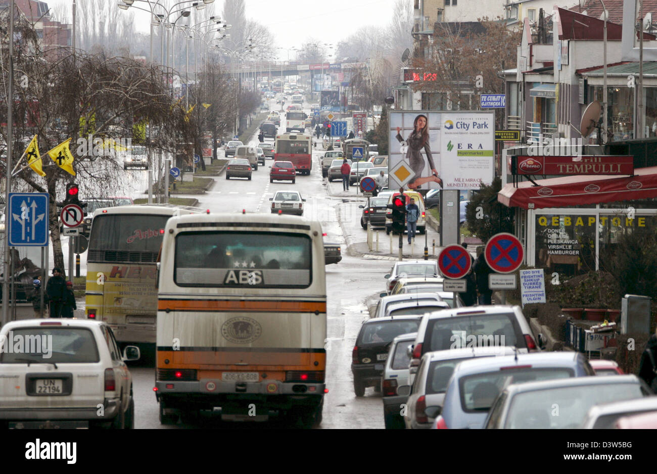 The traffic is pictured in the capital of the Kosovo, Pristina, Serbia, 11 December 2006. Administrated by the UN the Kosovo forms part of Serbia under international law. Pristina, as the third-biggest city of Serbia, is the biggest city of the Kosovo and its political, economic and cultural centre. The international missions of the UN, the EU and the OECD have their headquarters h Stock Photo
