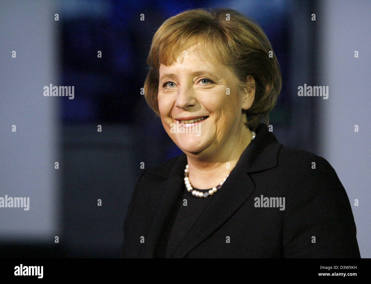 German Chancellor Angela Merkel smiles after giving a statement on the execution of former Iraqi dictator Saddam Hussein in Berlin, Germany, Saturday, 30 December 2006. Merkel renewed her rejection of death penalty but said her thoughts were with the innocent victims of Hussein. Photo: Axel Schmidt Stock Photo