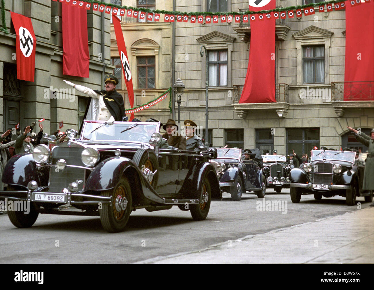 The undated movie scene shows Helge Schneider as Adolf Hitler greeting from his car in the film My Fuehrer - The Truly Truest Truth About Adolf Hitler ('Mein Fuehrer - Die wirklich wahrste Wahrheit uebre Adolf Hitler'). Swiss-Jewish director Dani Levy crosses all boundaries displaying Hitler as a picture of misery. The film is in German cinemas from 11 January 2007. Photo: X-Verlei Stock Photo