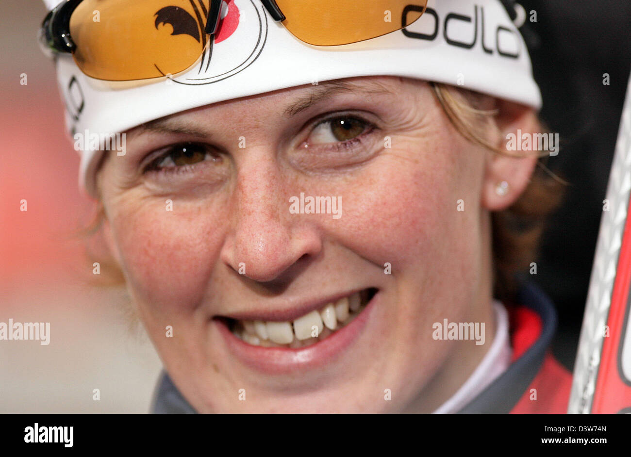 French biathlete Sandrine Bailly smiles after winning the 7.5km sprint ...