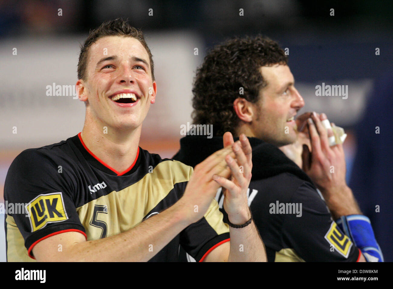 German handball national team players Dominik Klein (L) and Florian Kehrmann jubilate after the
