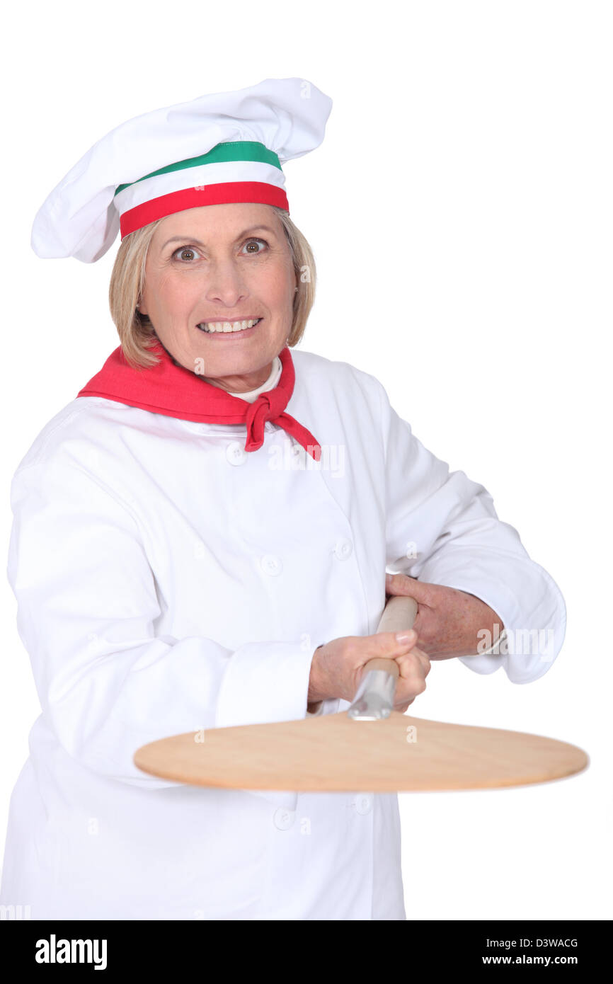 Senior pizza chef holding a pizza loading peel Stock Photo Alamy