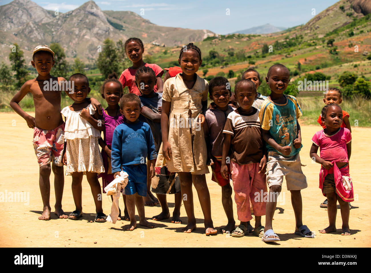 A group of children posing for a photo in the countryside in Ranohira situated on the edge of the Isalo National Park Madagascar Stock Photo