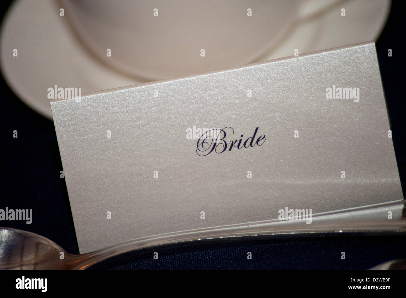 A card on the head table at a wedding displaying the name 'bride' Stock Photo
