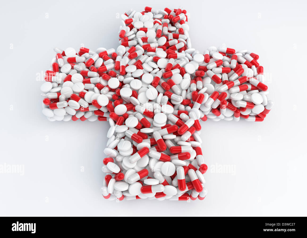 Piles of pills forming a medical cross symbol Stock Photo