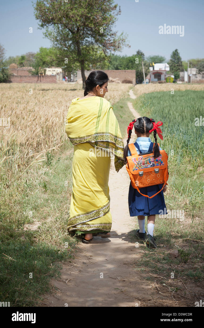 Indian village people walking with bag hi-res stock photography and ...