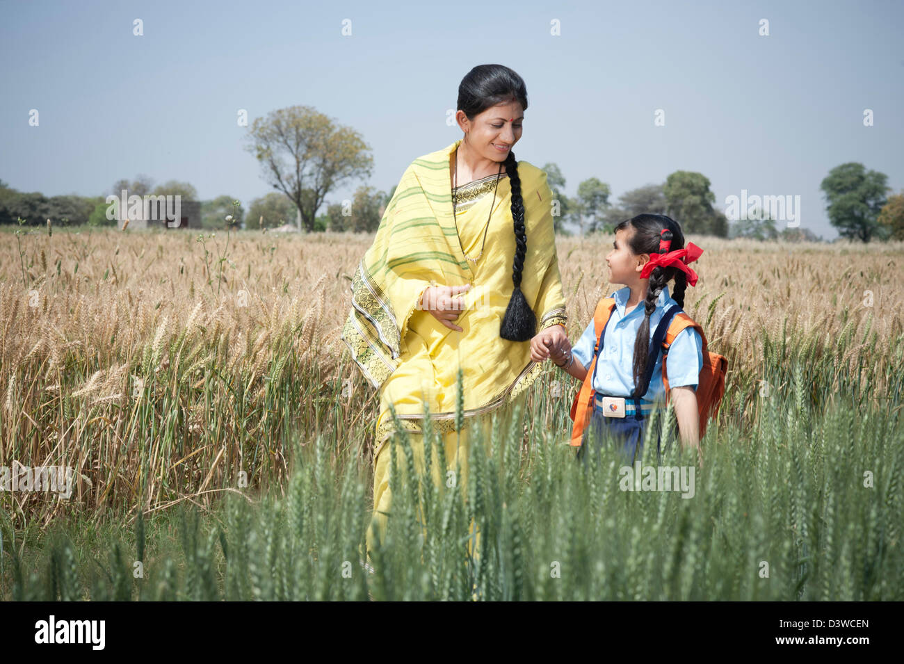 Indian village people walking with bag hi-res stock photography and ...