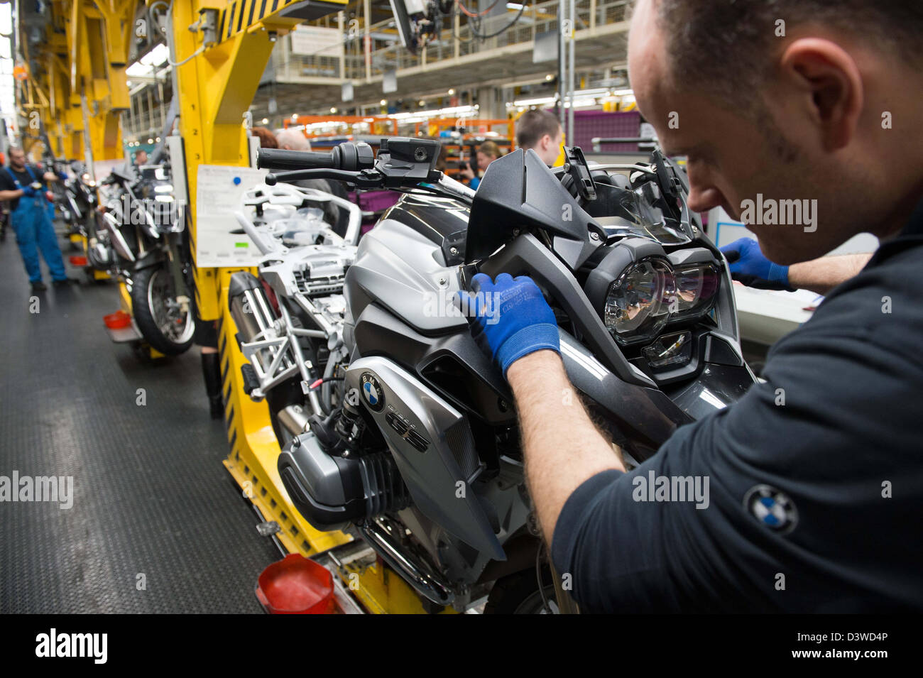Berlin, Germany. 25th Feb, 2013. Employee assemble motorcycles at the BMW motorcycle factory in