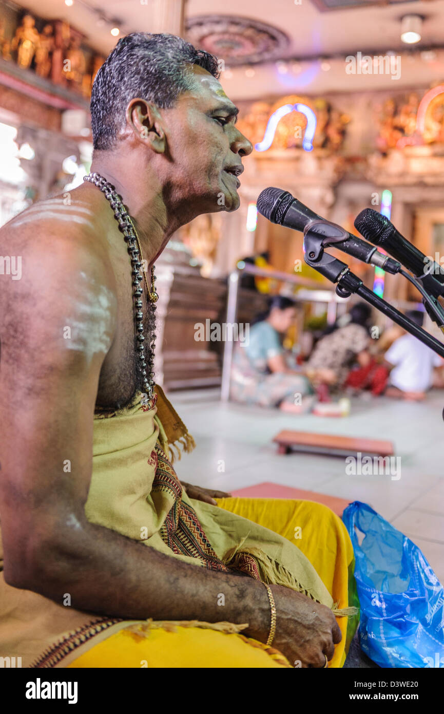 Portrait of a hindu priest singing inside Sri Veeramakaliamman temple, Singapur, Asia Stock Photo
