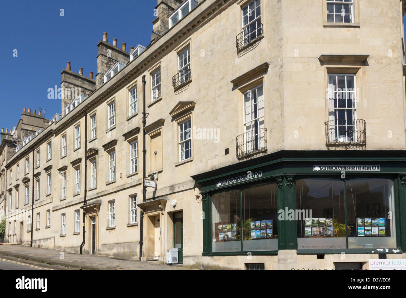 Fountain buildings at the bottom of Lansdown Road, Bath. The corner property houses Wildoak residential Estate agency Stock Photo