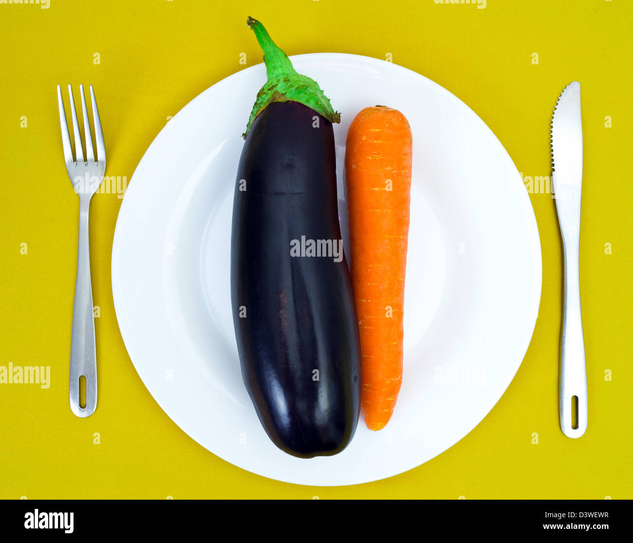 Eggplant and carrot on a white plate Stock Photo