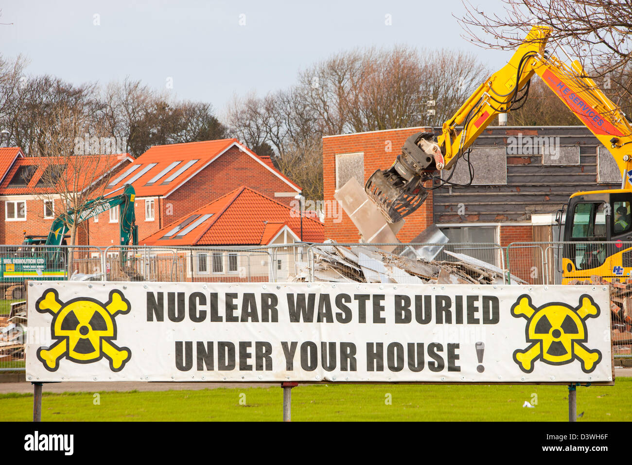 Nuclear protest sign and new housing. Stock Photo