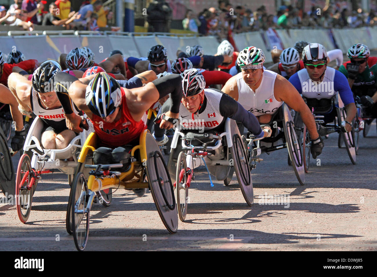 Aaron Pike (USA), Michel Filteau (Canada) Saul Mendoza Hernandez (mexico) in the T54 wheelchair marathon in the mall Stock Photo
