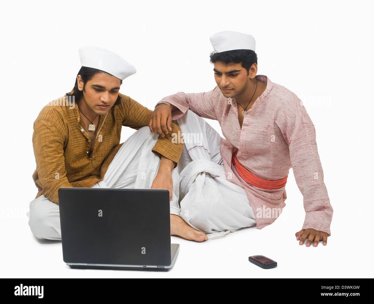 Man using a laptop with his friend Stock Photo - Alamy