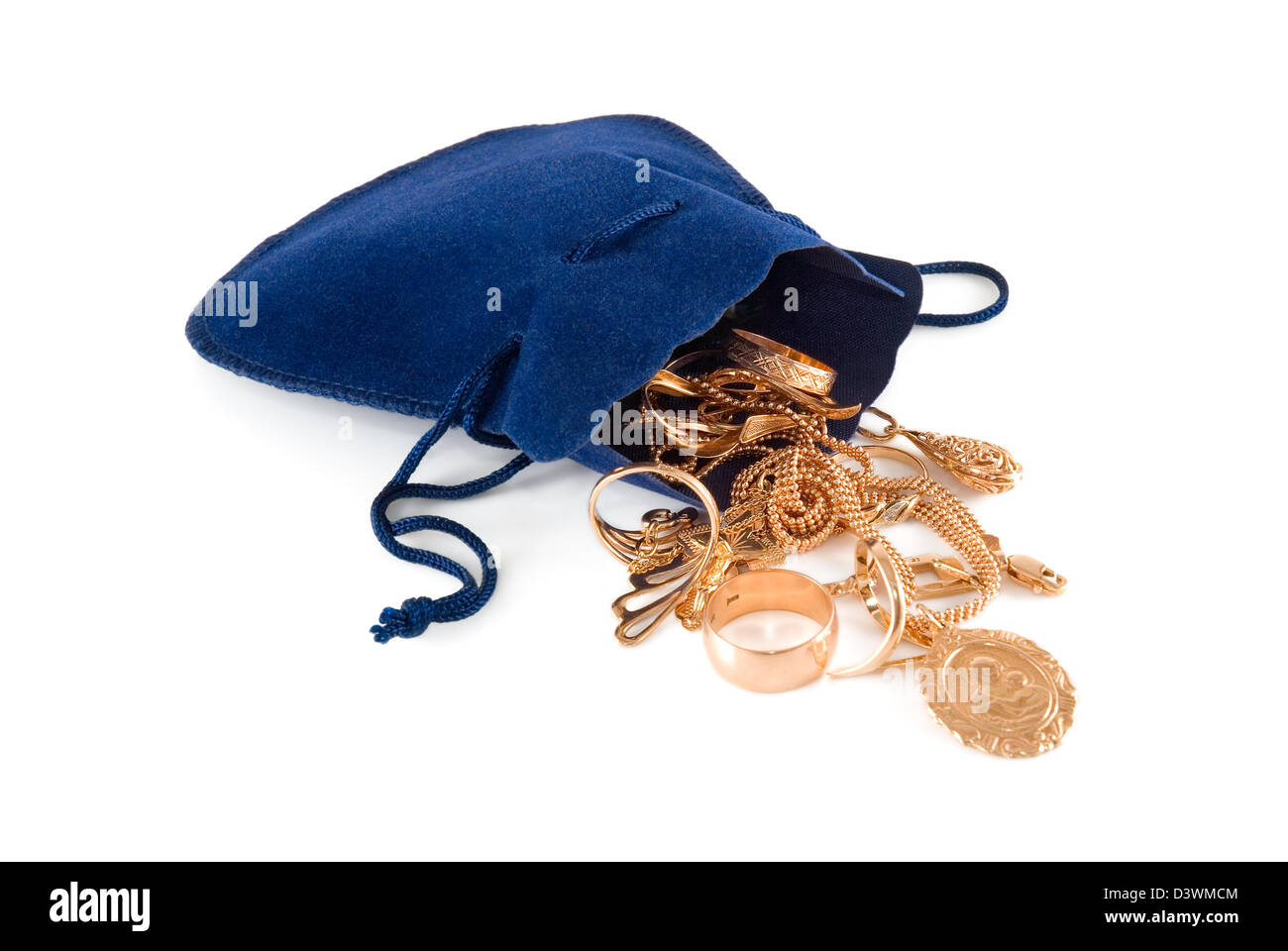 Gold jewelry in a dark blue velvet bag Stock Photo