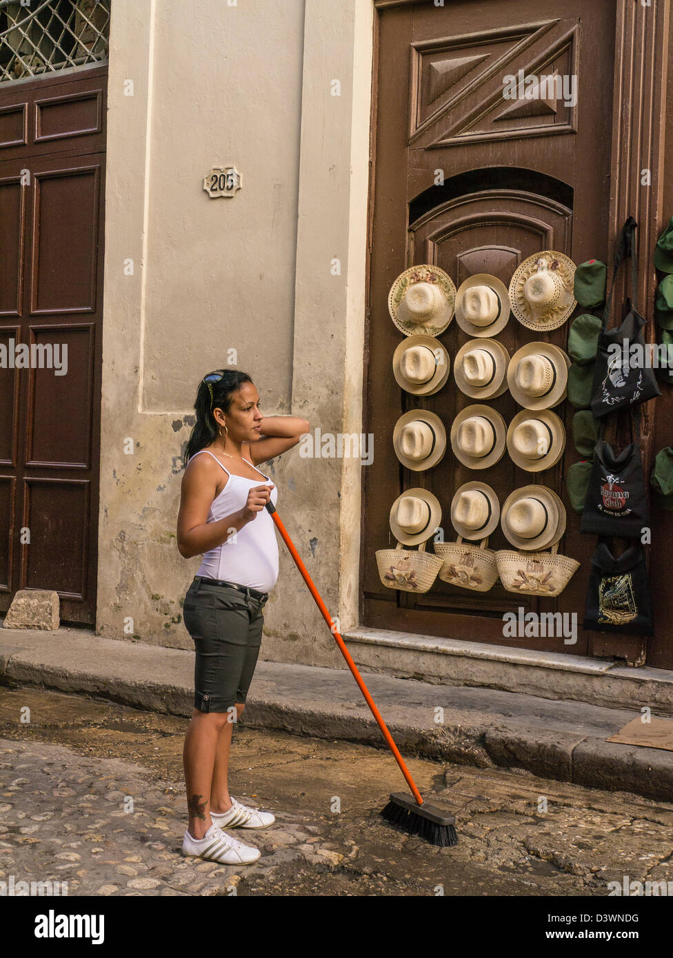 Cuban woman sweeping outside hires stock photography and images Alamy