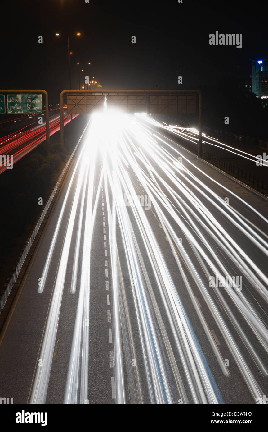 Streaks of headlights of moving vehicles on the road, National Highway