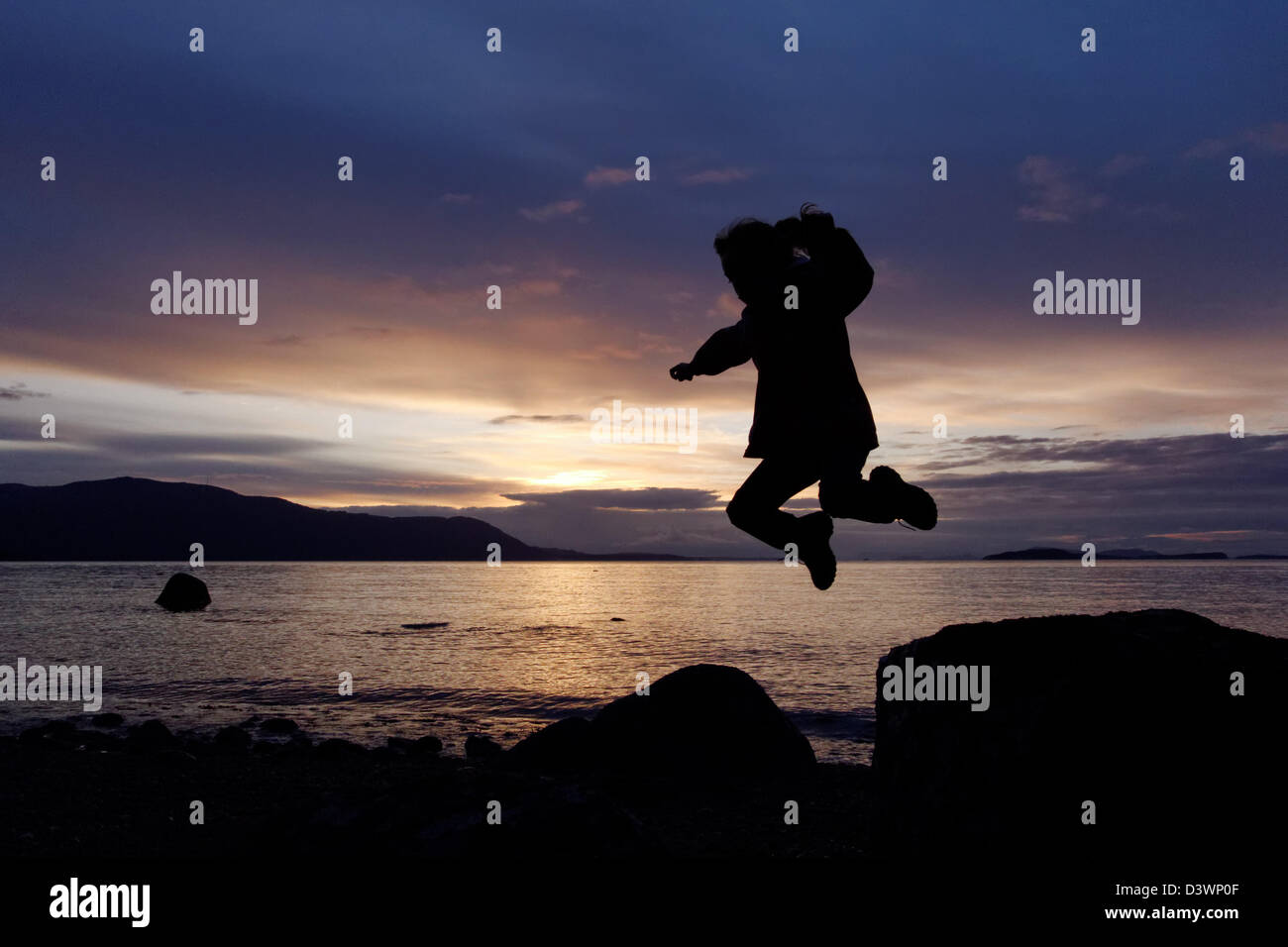 Child jumping with joy hi-res stock photography and images - Alamy