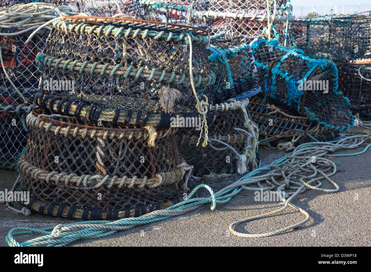 Crab pots stacked on Mudeford Quay, Christchurch Dorset UK February