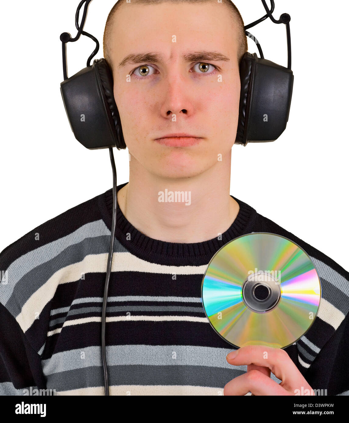 Sad disappointed teenager male music lover with big headphones and