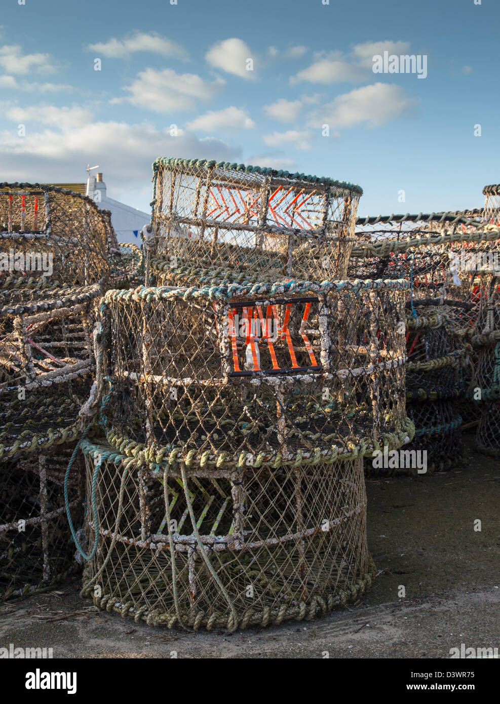 Crab pots stacked on Mudeford Quay, Christchurch Dorset UK February