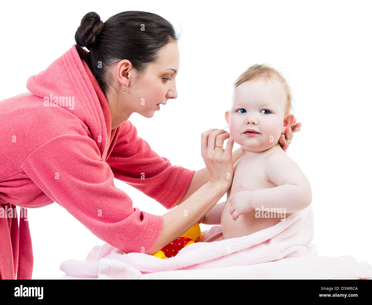 mother cleaning ears her baby after bathing Stock Photo