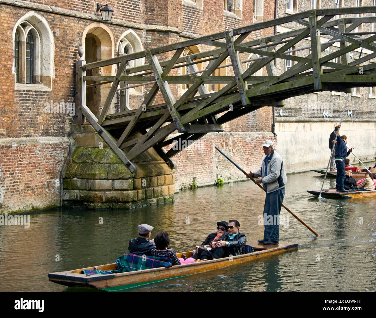 Punting on River Cam 'The Backs' by Mathematical bridge Queens College Cambridge Cambridgeshire England Europe Stock Photo
