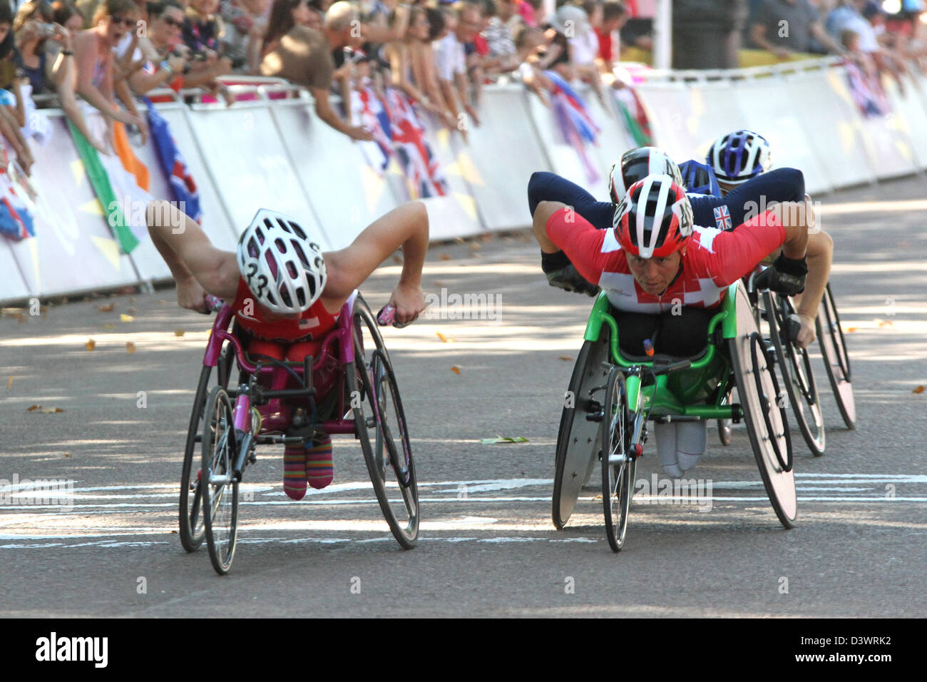 Amanda McGrory of USA (L) and Sandra Graf of Switzerland (R) in the womens T54 wheelchair marathon in the Mall during the London Stock Photo