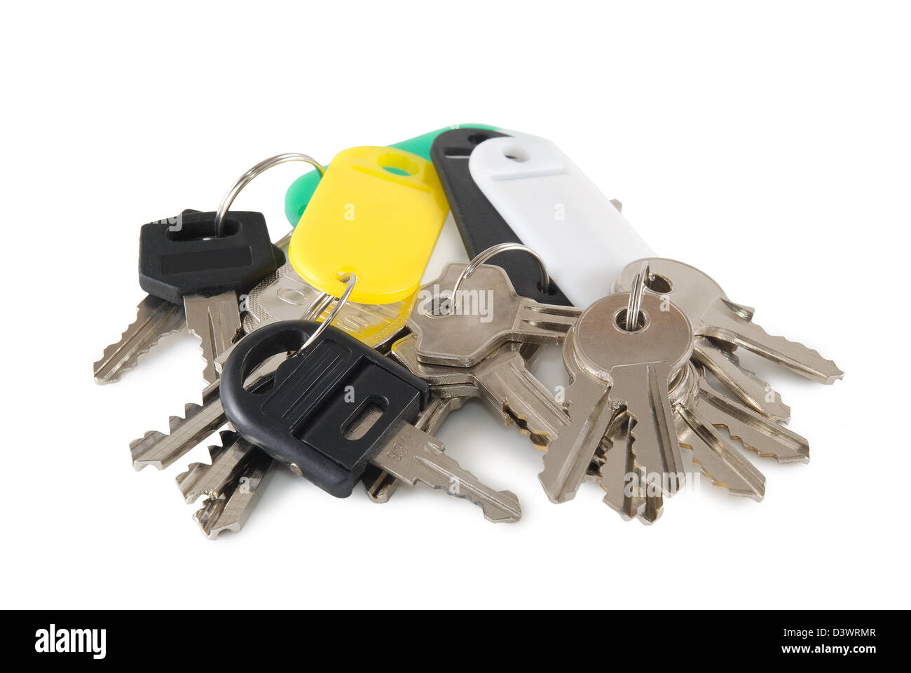 Eighteen keys are photographed on a white background Stock Photo