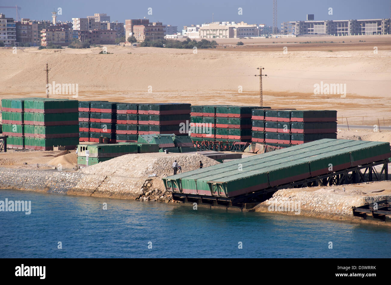 A cargo ship transits northbound through the Suez Canal. Stock Photo