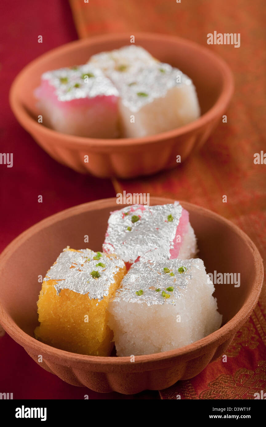 Color Burfi Colorful coconut burfi in bowls Stock Photo - Alamy