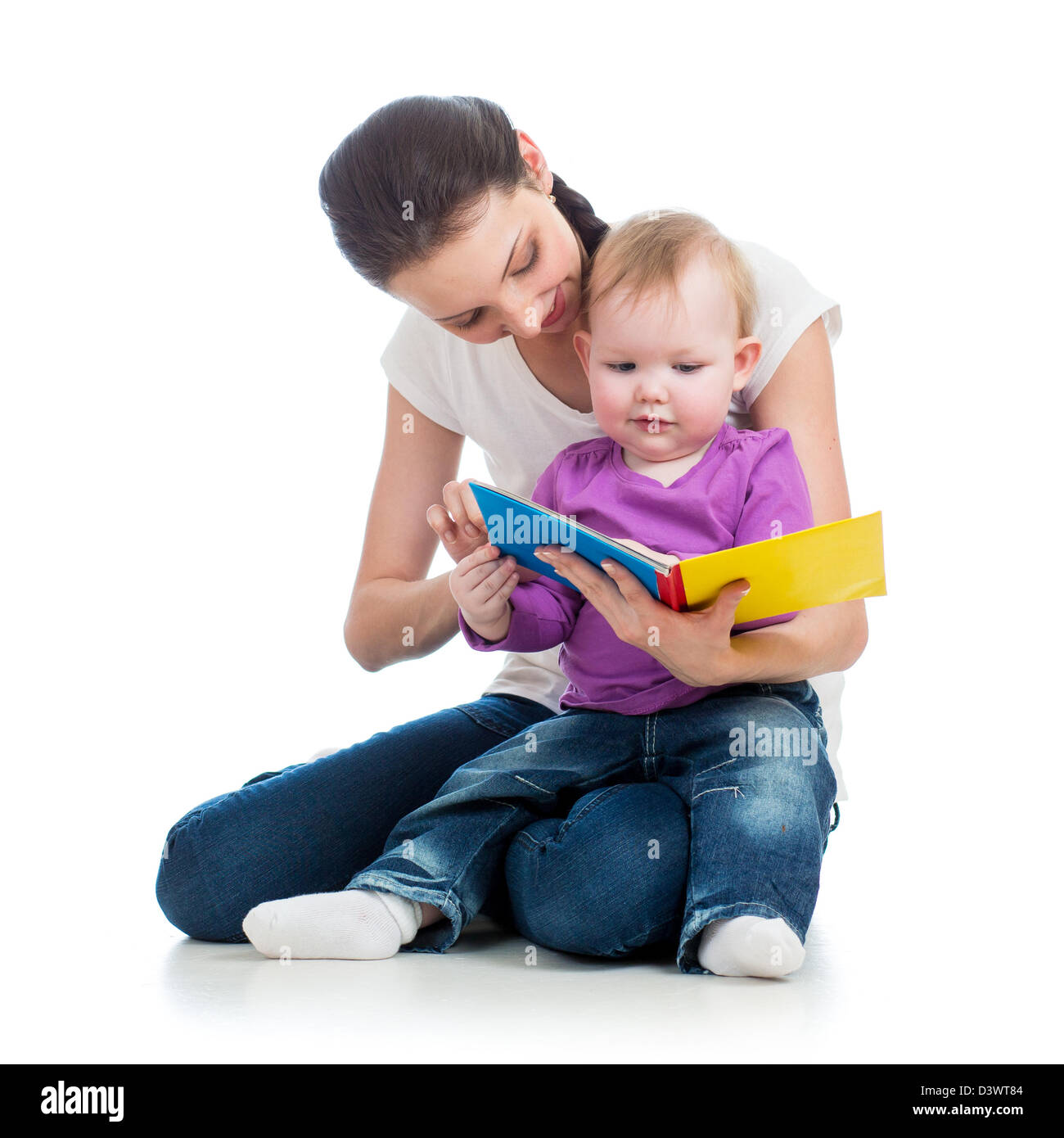 happy mother reading a book to kid girl Stock Photo
