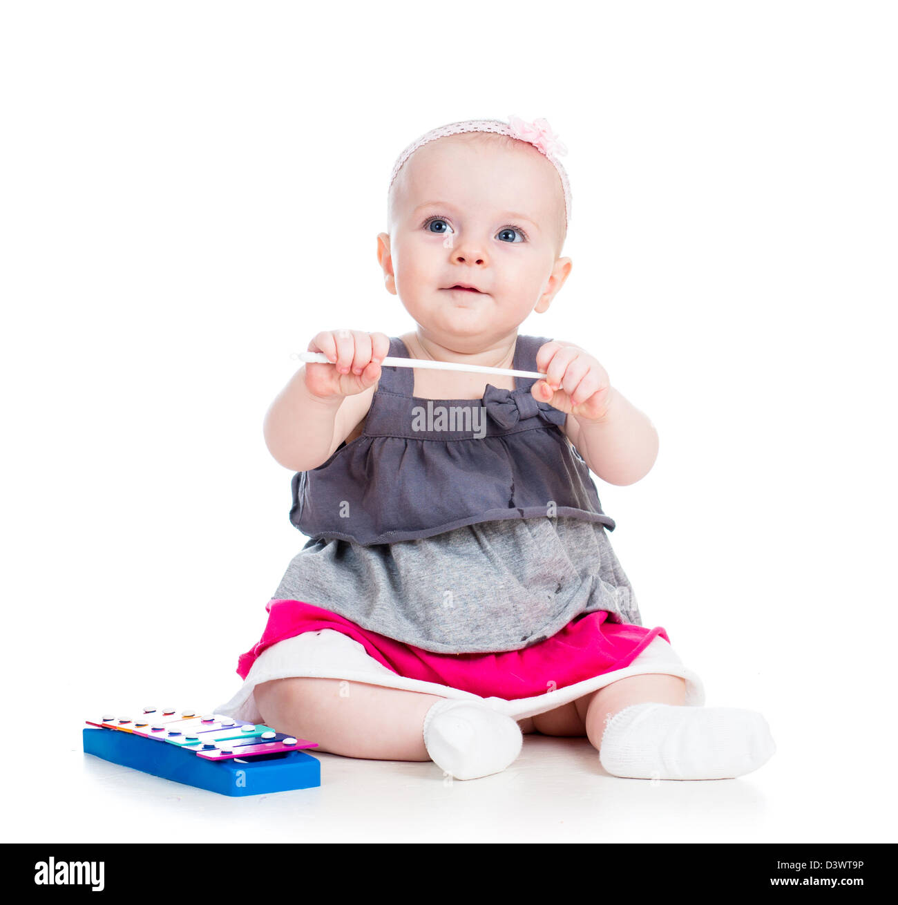 little girl playing musical toy Stock Photo - Alamy