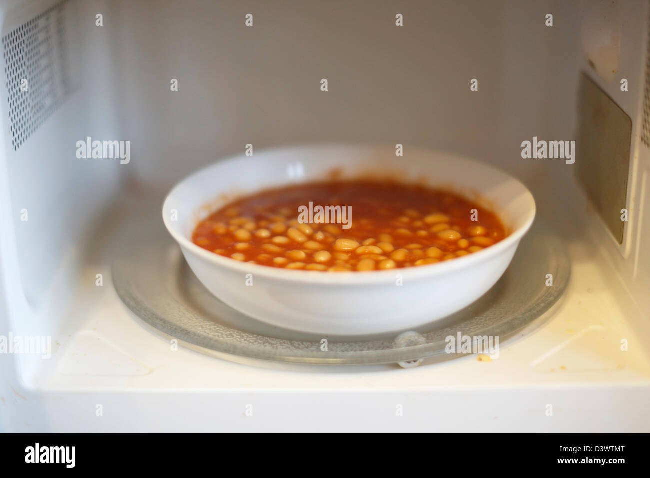 Heinz Baked Beans in a microwave Stock Photo Alamy