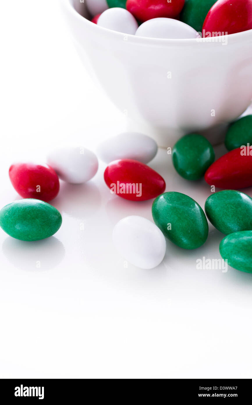 Colorful red, green and white candies on white background Stock Photo Alamy