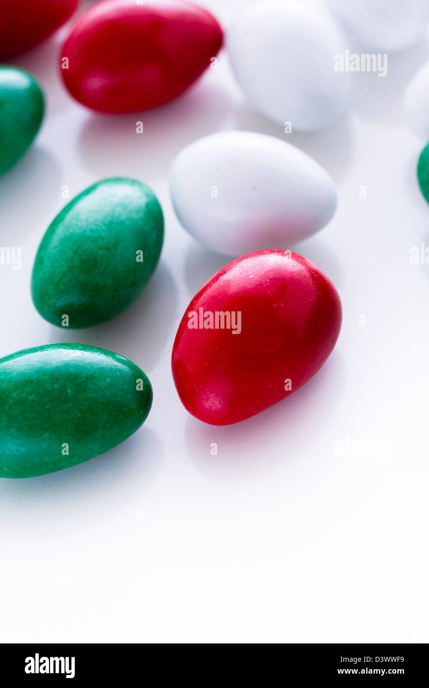 Colorful red, green and white candies on white background Stock Photo Alamy
