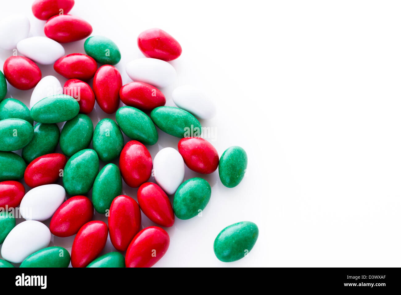 Colorful red, green and white candies on white background Stock Photo Alamy
