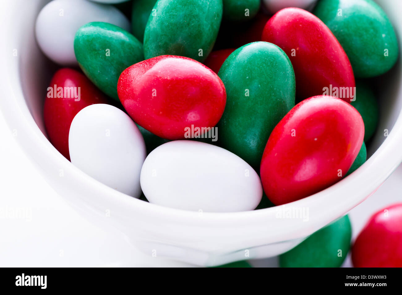 Colorful red, green and white candies on white background Stock Photo Alamy