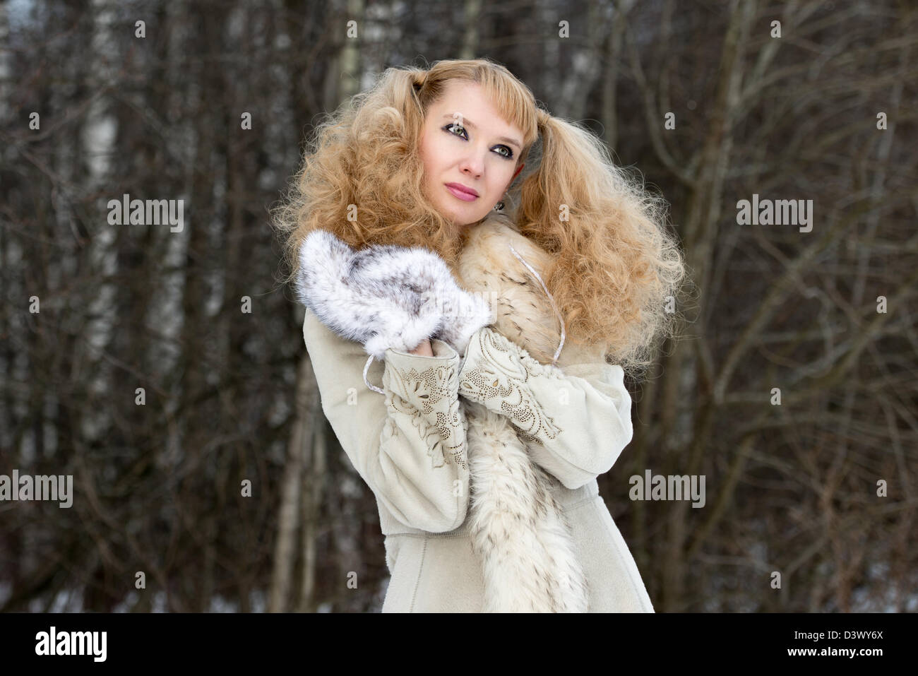 Dreamy pretty young woman in a winter forest in a fur coat Stock Photo ...