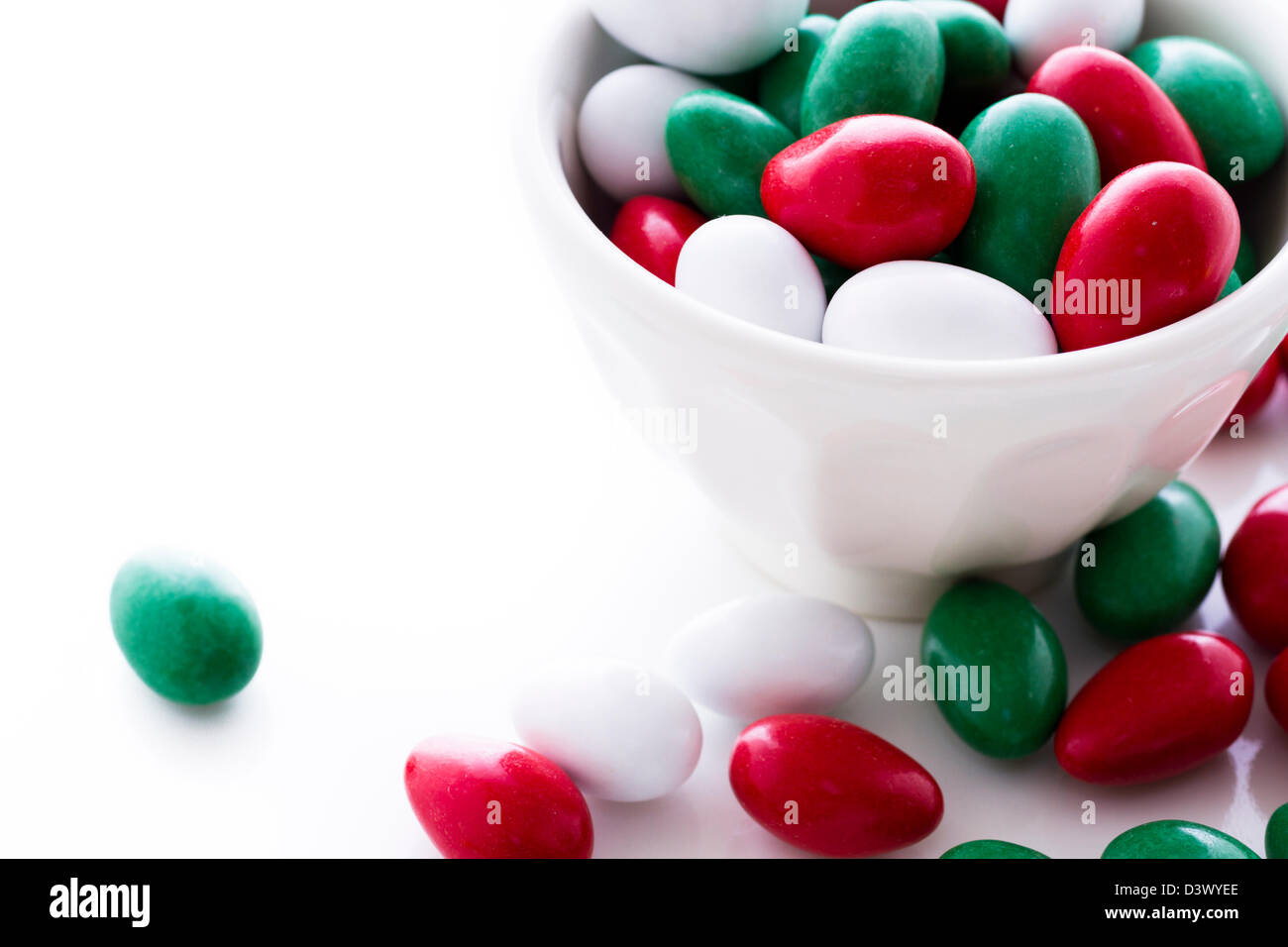 Colorful red, green and white candies on white background Stock Photo Alamy