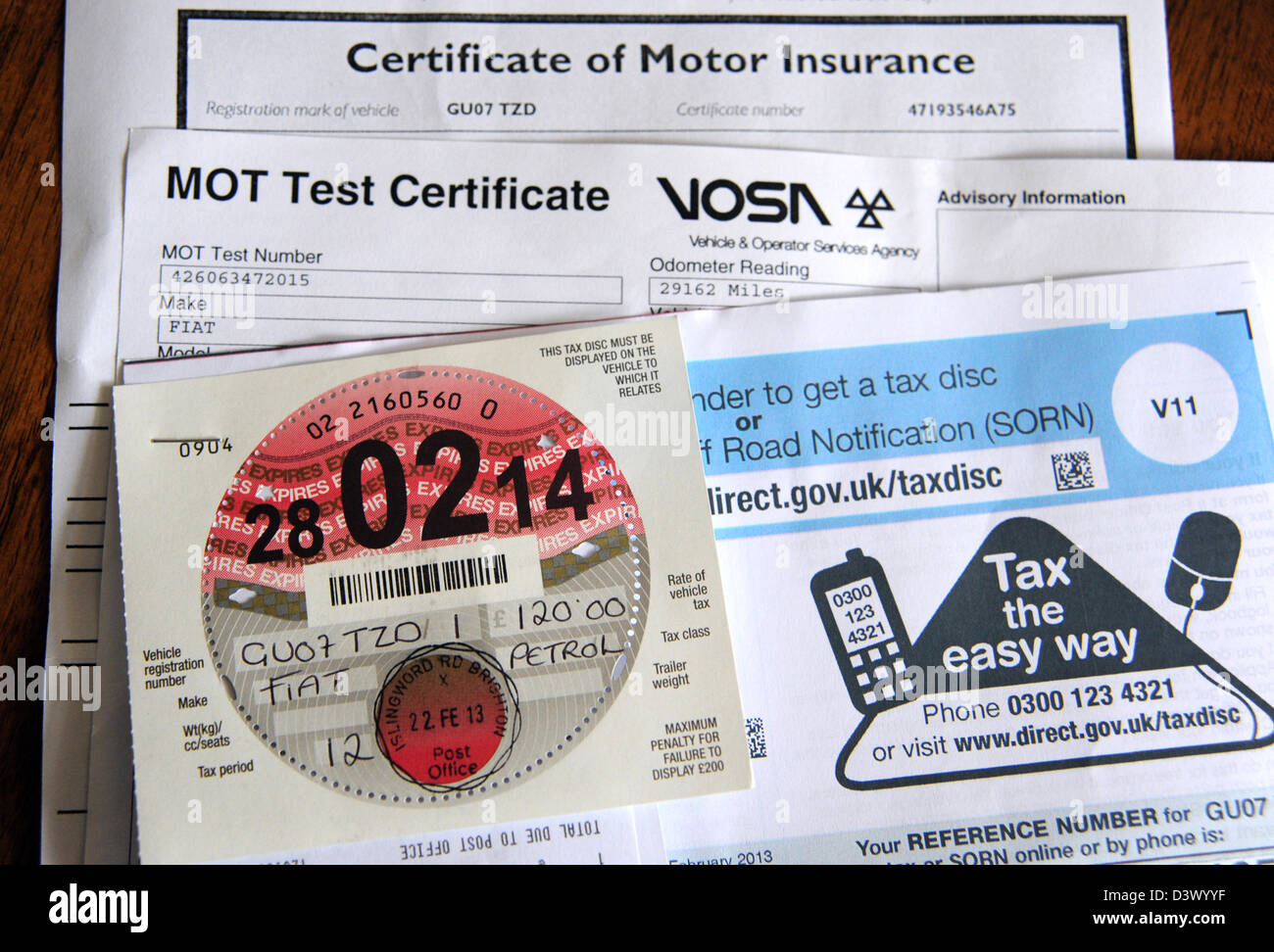 New car road tax disc for 2013 with MOT and insurance certificate UK