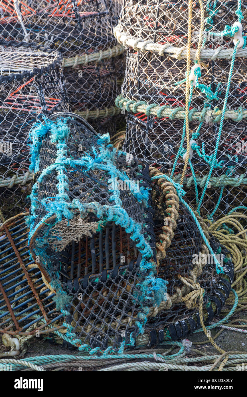 Crab pots stacked on Mudeford Quay, Christchurch Dorset UK February